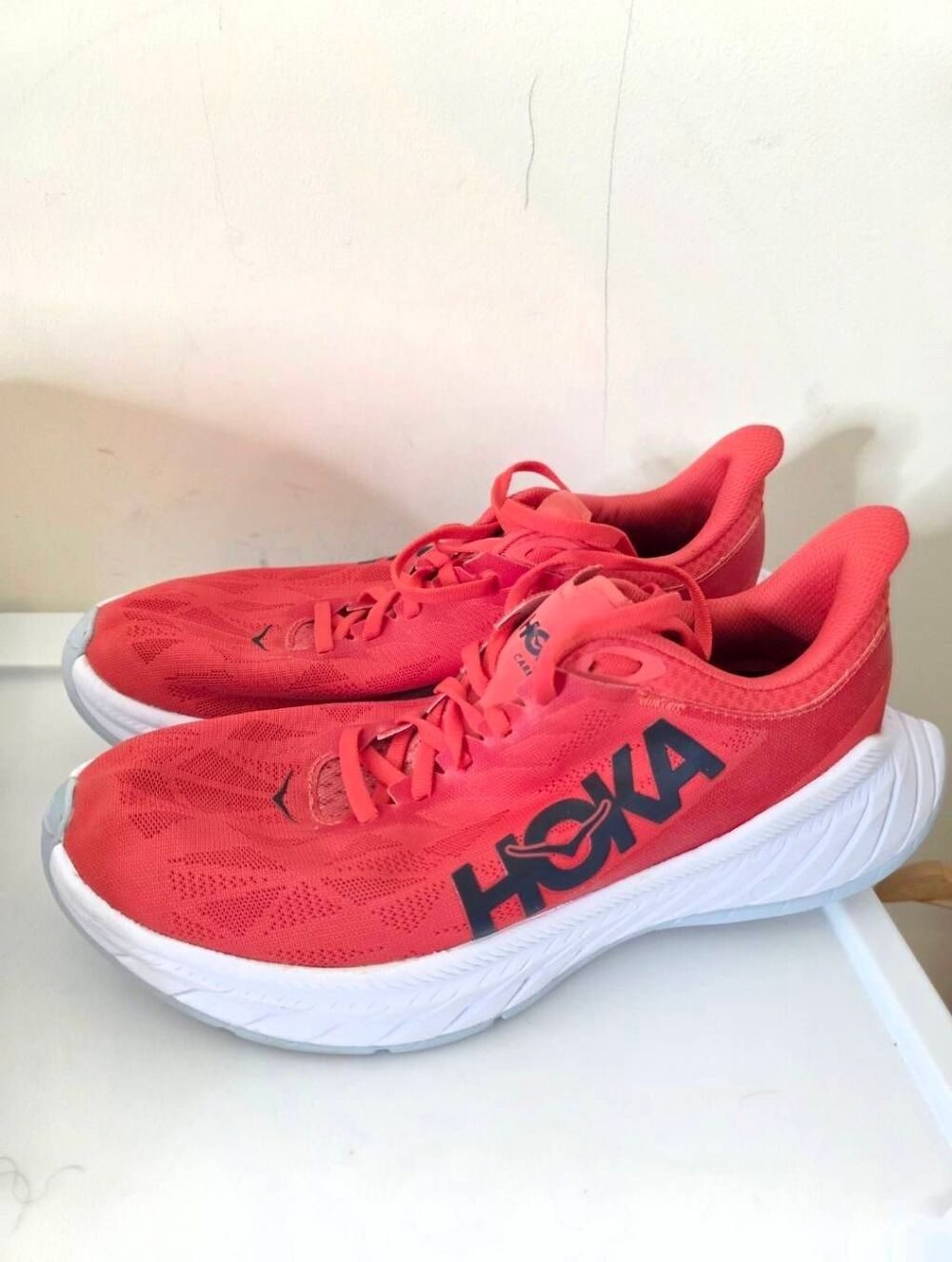 HOKA Carbon X 2 running shoes in a vibrant red or hot coral Size 9.5B